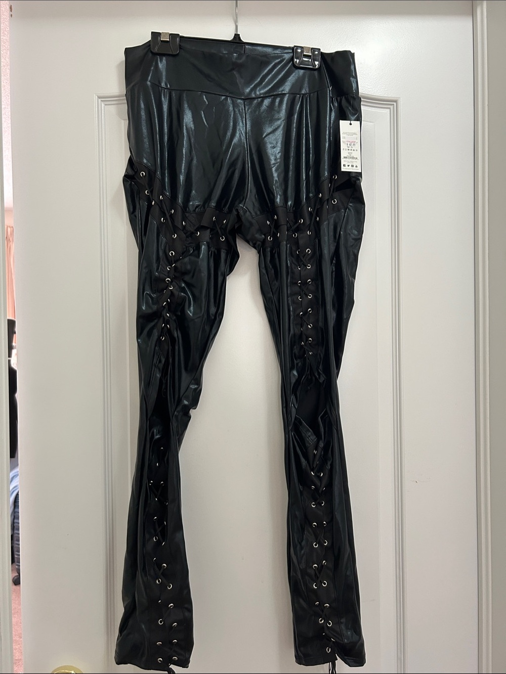 DARQUE by Coquette Black Faux Leather Lace-Up leggings.